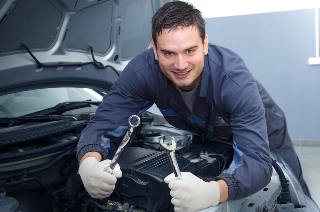 Professional car mechanic in repair shop.